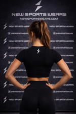 Black workout crop top for women front view lightning logo