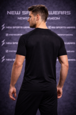 Male athlete running on treadmill wearing running t shirt