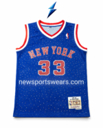 Blue basketball jersey showing NEW YORK lettering and rhinestone graphics