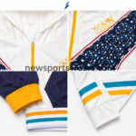 Men’s white tracksuit NSW chest detail with navy geometric V-panel and red piping