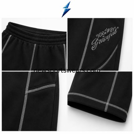 NSW baggy sweatpants in black with grey contrast stitching and graphic thigh details