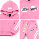 NSW Kids tracksuit showing white sleeve and leg stripes with precise pink stitching