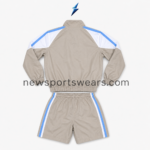 nsw windbreaker tracksuit by new sports wear showing plain taupe rear panels with white and blue shoulder stripes