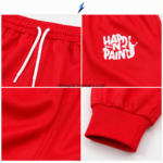 NSW red graphic joggers with white basketball-inspired thigh print