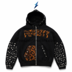 NSW Rhinestone Zip Up Hoodie front in black with silver studded sleeves, orange graphic lettering and patterned pocket