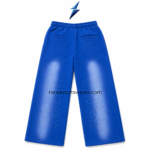 NSW New Sports Wear blue sweatpants waistband close-up with elastic construction and white drawstring